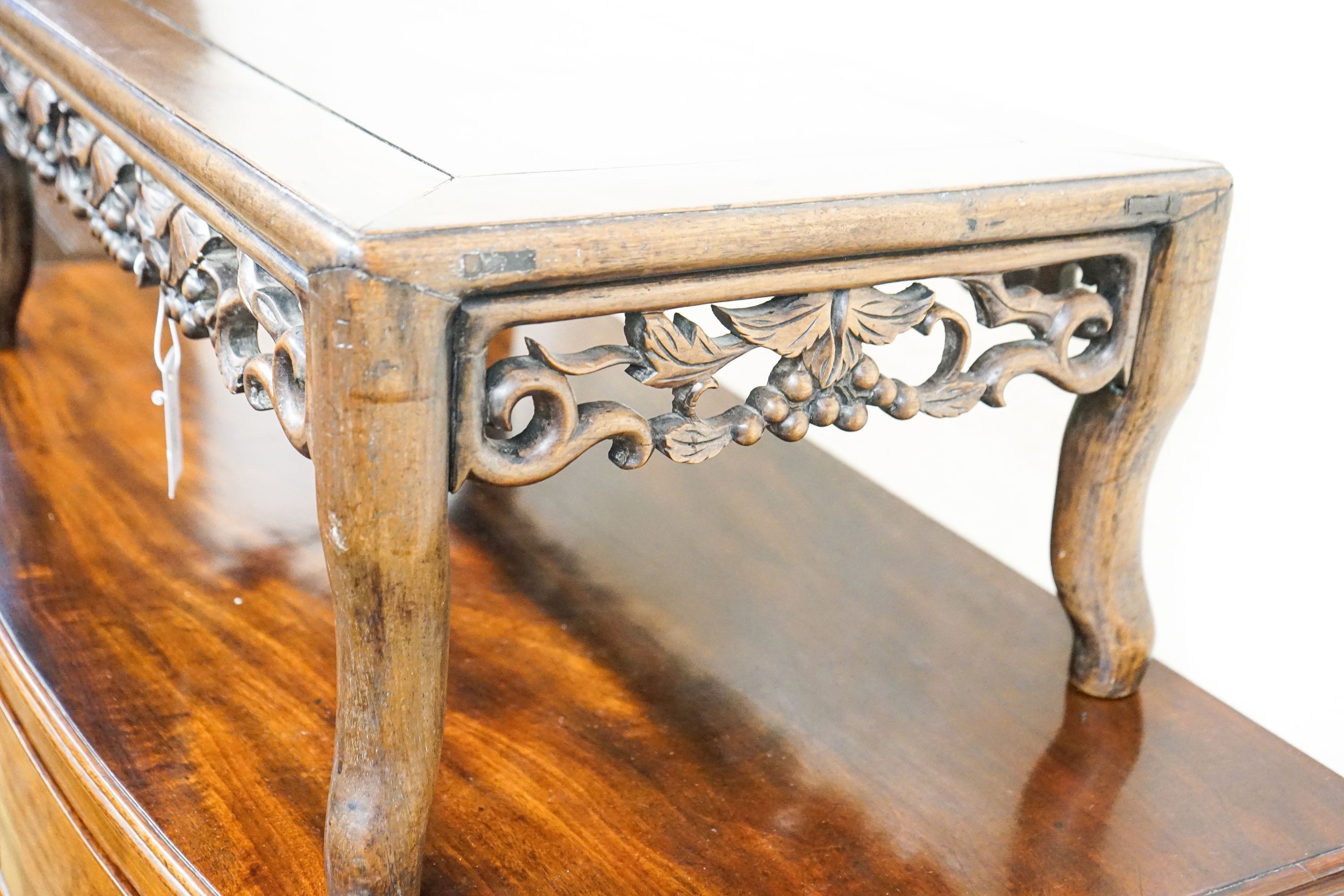 A Chinese carved hongmu low occasional table, width 76cm, depth 41cm, height 27cm